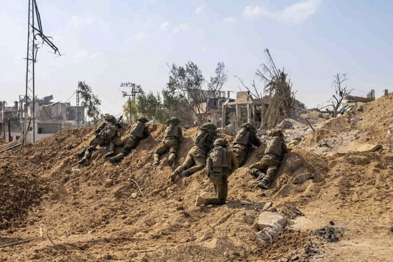 IDF handout image shows Israeli soldiers take position in the Gaza Strip