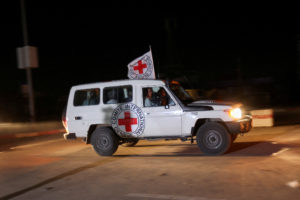 A Red Cross vehicle, as part of a convoy believed to be carrying hostages abducted by Hamas militants during the October 7 attack on Israel, arrives at the Rafah border, amid a hostages-prisoners swap deal between Hamas and Israel, in southern Gaza Strip November 24, 2023. Photo by Ibraheem Abu Mustafa/REUTERS