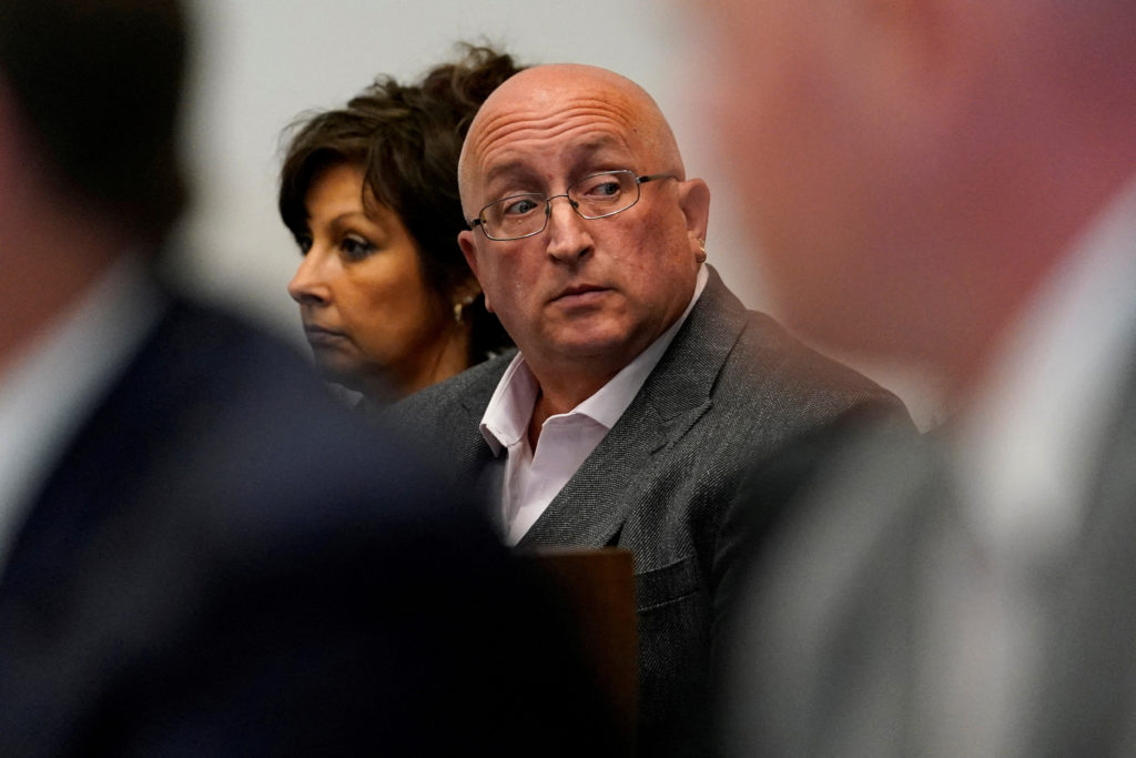 FILE PHOTO: Robert E. Crimo III's mother Denise Pesina and father Robert Crimo Jr. attend a hearing for their son in Lake ...