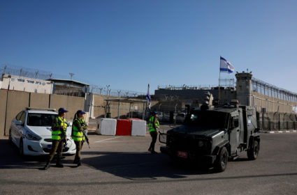 Israeli military personnel stand guard after a van carrying Palestinian prisoners arrived to the Israeli military prison, ...
