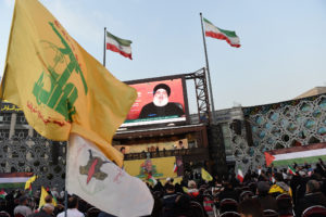 People attend a gathering in support of Palestinians, in Tehran