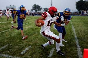 Players compete in a high school football game on the Rosebud Indian Reservation in Mission, South Dakota