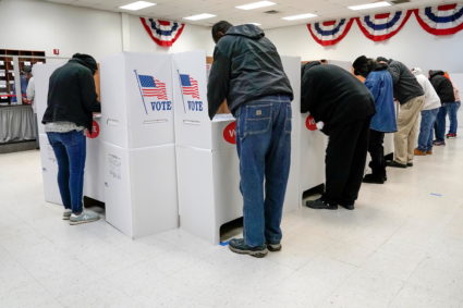 Voters stand at voting booths during early voting at the Oklahoma Election Board in Oklahoma City