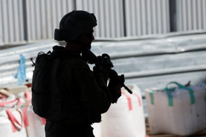 A member of the Israeli security forces walks during clashes following the funeral of seven-year-old Palestinian boy Rayyan Suleiman, who according to his father has died of heart failure while being chased by Israeli soldiers, east of Bethlehem, Israeli-occupied West Bank September 30, 2022. Photo by Mussa Qawasma/REUTERS