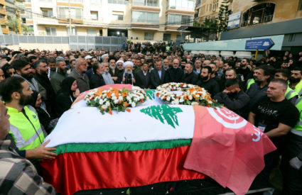 Mourners stand near the coffins of the two journalists working for Lebanon-based Al Mayadeen TV channel who are said to be killed by an Israeli strike on Tuesday in southern Lebanon, as they gather outside the channel's building to offer prayers ahead of their funeral, in Beirut, Lebanon November 22, 2023. Photo by Aziz Taher/REUTERS