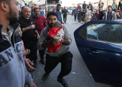 Wounded Palestinians are rushed into Nasser hospital, in Khan Younis