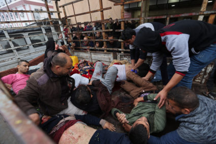 Wounded Palestinians are rushed into Nasser hospital, in Khan Younnis