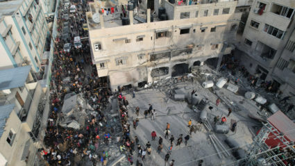 Palestinians gather at the site of an Israeli strike on a mosque, in Rafah