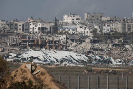 Destroyed buildings lie in ruin in Gaza, as seen from Israel