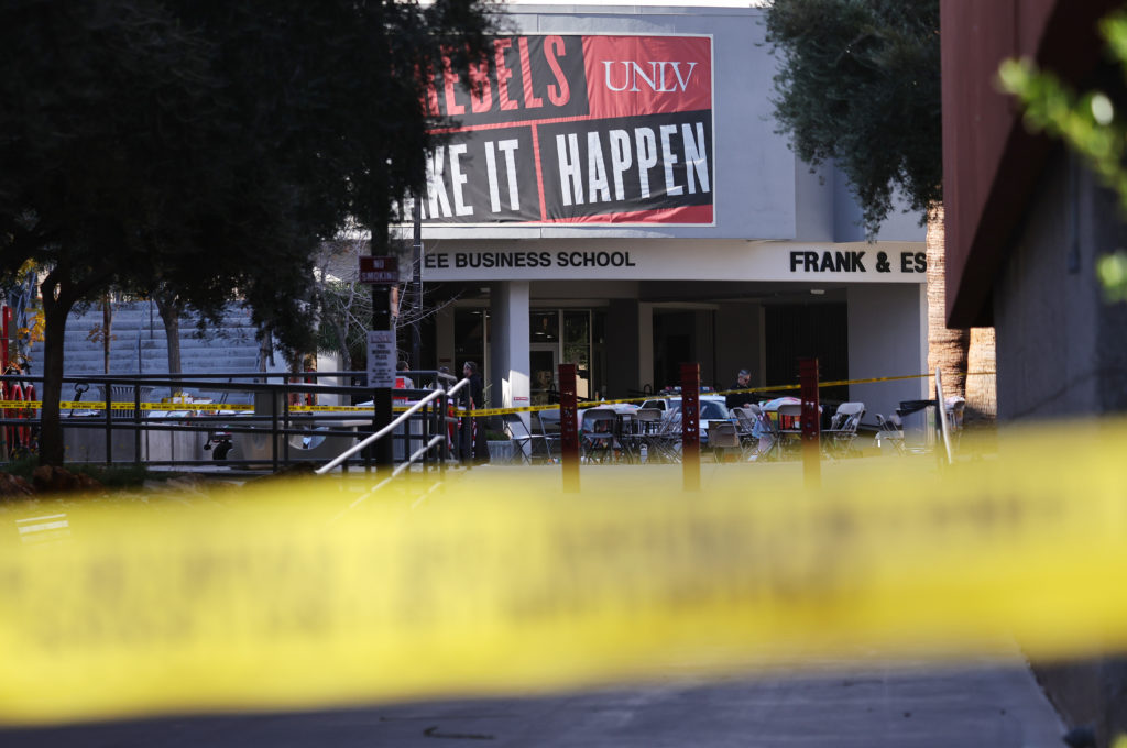 Police tape cordons off the scene outside Frank and Estella Beam Hall, where the UNLV Lee Business School is located, the ...