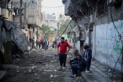 Palestinians react at the site of Israeli strikes in Khan Younis