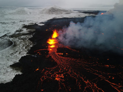An aerial view of lava spewing from the site of the volcanic eruption north of Grindavik
