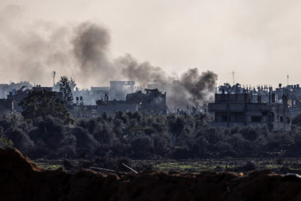 Smoke rises from damaged buildings, amid the ongoing ground operation of the Israeli army against Palestinian Islamist group Hamas, in the Gaza Strip, December 15, 2023. Photo by Amir Cohen/REUTERS