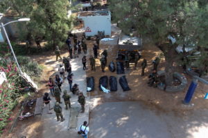 An aerial view shows the bodies of victims of an attack following a mass infiltration by Hamas gunmen from the Gaza Strip,...