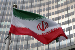 FILE PHOTO: The Iranian flag flutters in front of the International Atomic Energy Agency (IAEA) organisation's headquarter...