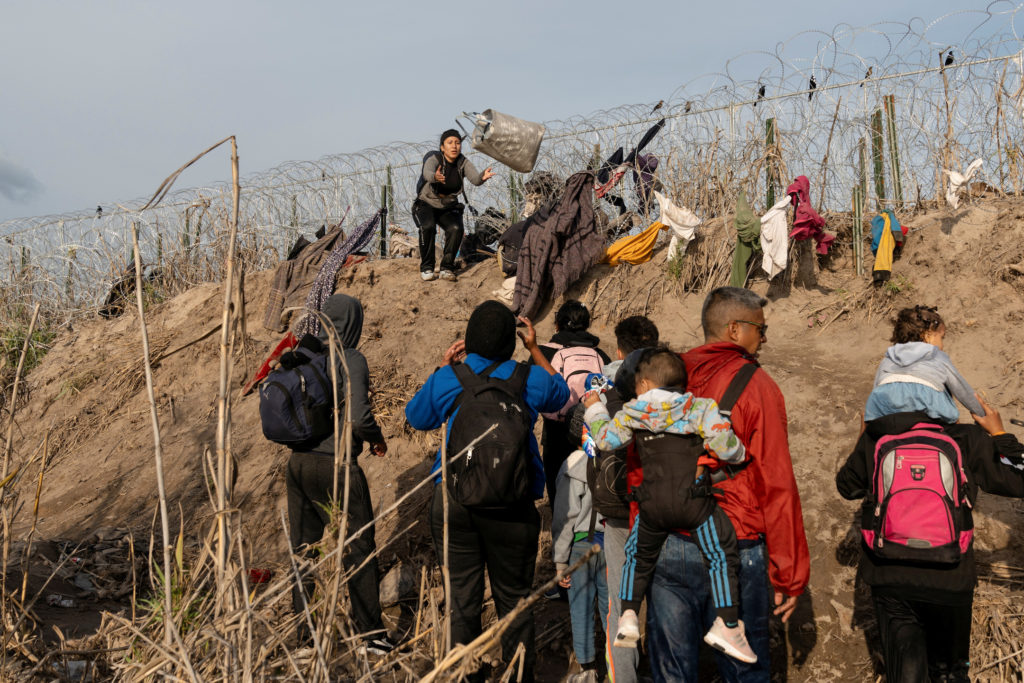 Migrants cross from Mexico to Eagle Pass, Texas
