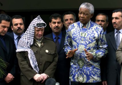 Former South African president Nelson Mandela (R) and Palestinian President Yasser Arafat (L) address the media after holding talks on the crisis in the Middle East May 3, 2001. Photo by JN/WS/REUTERS