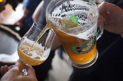 Beer is poured for participants during a tour at the Brooklyn Brewery in New York