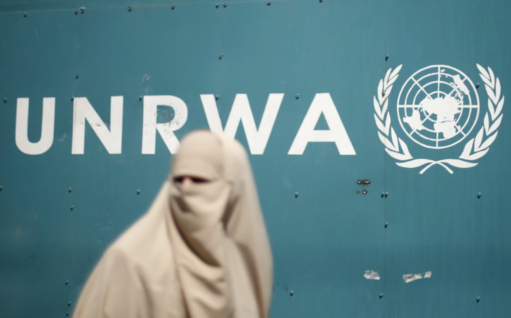 A Palestinian woman takes part in a protest against possible reductions of the services and aid offered by UNRWA in front ...