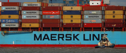 The Maersk Line container ship Maersk Sentosa is helped by tugs as it navigates the River Mersey in Liverpool