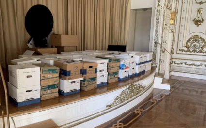 Photographs of former U.S President Donald Trump boxes of classified documents stored on a ballroom stage, in a club bathroom