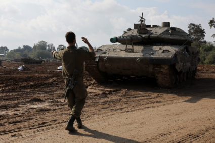 Israeli tank is loaded onto a truck, in southern Israel