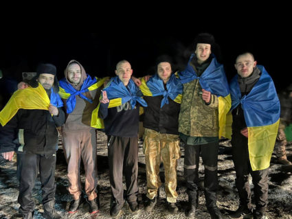 Ukrainian POWs pose after a swap at an unknown location in Ukraine