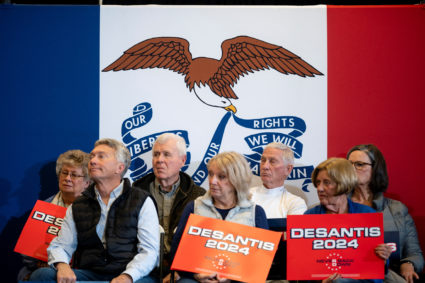 Audience members listen as Republican presidential candidate Florida Governor Ron DeSantis speaks during a campaign event in Waukee, Iowa, U.S., January 3, 2024. Photo by Cheney Orr/REUTERS