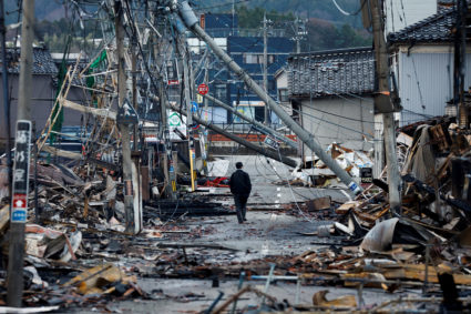 Scenes of loss play out across Japan's western coastline after quake kills 84