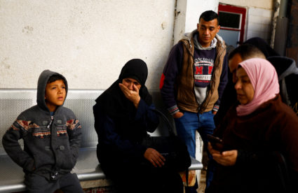 Mourners react next to the bodies of Palestinians killed in an Israeli strike, amid the ongoing conflict between Israel an...