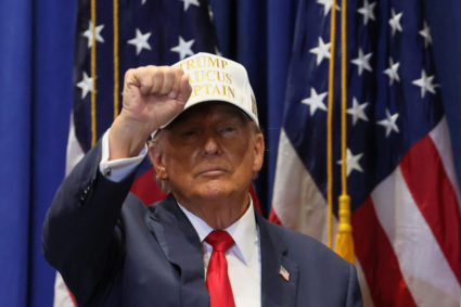 Former U.S. President and Republican presidential candidate Donald Trump gestures as he campaigns in Indianola, Iowa, U.S., January 14, 2024. Photo by Brendan McDermid/REUTERS