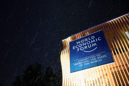 A banner for the World Economic Forum hangs on a building during snowfall, on the first day of the annual meeting in Davos, Switzerland, January 15, 2024. Photo by Denis Balibouse/REUTERS
