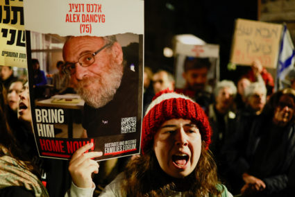 Families of hostages and supporters hold signs during a protest to call for the immediate release of hostages kidnapped during the deadly October 7 attack by Palestinian Islamist group Hamas, outside Israeli Prime Minister Benjamin Netanyahu's residence, in Jerusalem January 22, 2024. Photo by Ammar Awad/Reuters
