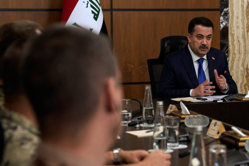Iraqi Prime Minister Mohammed Shia al-Sudani attends the first session of negotiations between Iraq and the United States ...