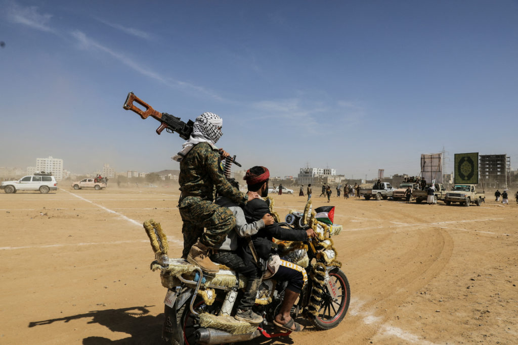 Armed Houthi followers parade in Sanaa