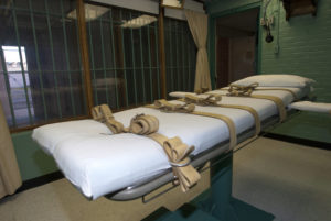 The death chamber and the steel bars of the viewing room are seen at the state penitentiary in Huntsville, Texas
