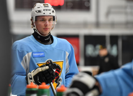 A Wilkes-Barre Penguins player #84 Clay Hanus wears a neck