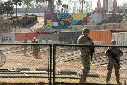 Migrants cross the border into Texas from Mexico