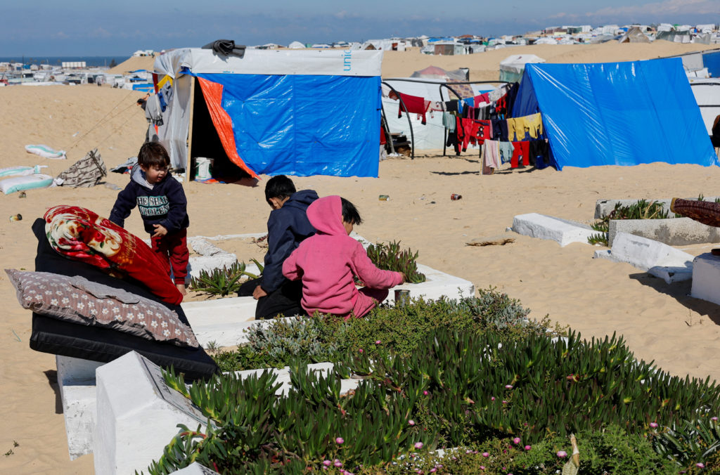 Displaced Palestinians shelter in a cemetery in Rafah in the southern Gaza Strip