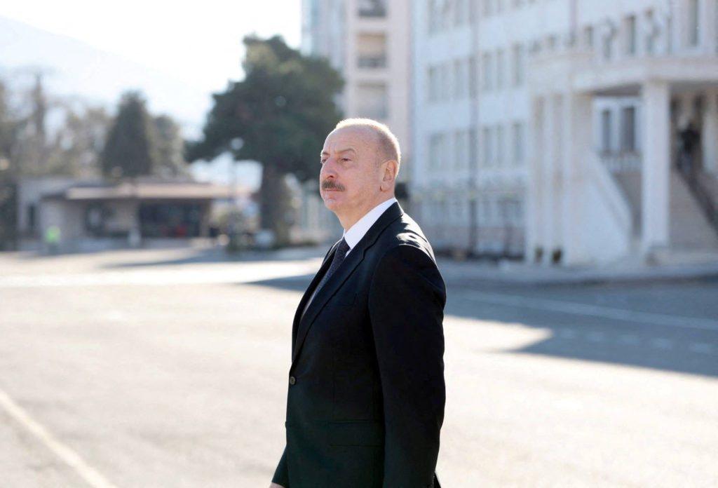 Azerbaijan's incumbent President and a candidate for ongoing Azeri presidential elections Ilham Aliyev walks out of a poll...