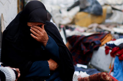 A Palestinian woman reacts at the site of an Israeli strike on a house, amid the ongoing conflict between Israel and the Palestinian Islamist group Hamas, in Rafah in the southern Gaza Strip, February 9, 2024. Photo by Ibraheem Abu Mustafa/Reuters