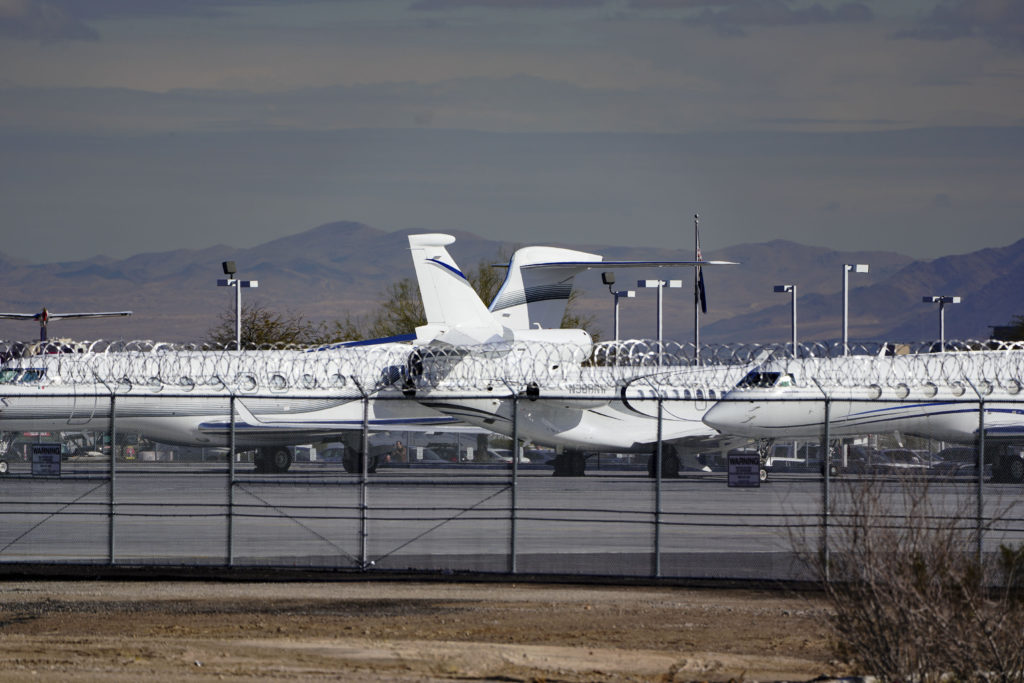 Private planes parked nose-to-tail to maximize space are seen at the Las Vegas airport in advance of Super Bowl LVIII in L...