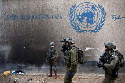 Israeli soldiers operate next to the UNRWA headquarters, amid the ongoing conflict between Israel and the Palestinian Islamist group Hamas, in the Gaza Strip, February 8, 2024. Photo by Dylan Martinez/Reuters
