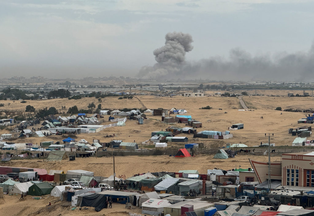 Smoke rises during an Israeli ground operation in Khan Younis, as seen from a tent camp sheltering displaced Palestinians ...