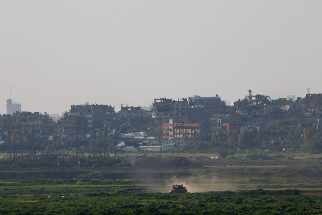 An Israeli tank manoeuvres in Gaza, as seen from Israel