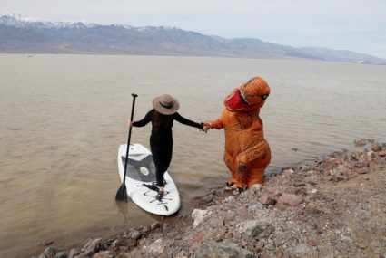 Strong winter storm and snow to hit the West while the Midwest gets unusual taste of summer