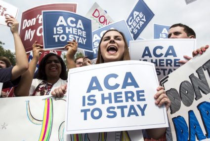 Supporters of the Affordable Care Act celebrate after the Supreme Court up held the law in the 6-3 vote at the Supreme Cou...