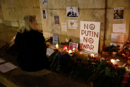 People attend a vigil following the death of Russian opposition leader Alexei Navalny, in Paris