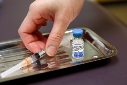 A vial of the measles, mumps, and rubella (MMR) vaccine is pictured at the International Community Health Services clinic ...