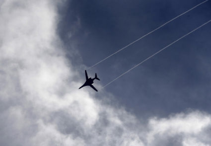 A U.S. Air Force B-1 bomber aircraft flies over the Syrian town of Kobani, as seen from the Mursitpinar crossing on the Tu...